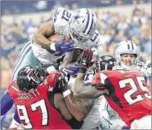  ?? RONALD MARTINEZ / GETTY IMAGES ?? Cowboys running back Joseph Randle dives in for a 1-yard touchdown and a 14-0 first-half lead. Randle started strong but only gained 2 yards on his final 11 carries.