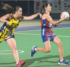  ?? Pictures: ANNA ROGERS ?? TOUGH BATTLE: North Cairns Tigers’ Jave Barrett closes in on Trinity Beach Bulldogs Sharks’ Amanda Barton.