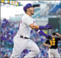  ?? Charles Rex Arbogast The Associated Press ?? Cubs catcher Willson Contreras celebrates his grand slam off Pirates reliever Bryse Wilson during the first inning at Wrigley Field.