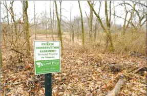  ?? Andy Shupe/NWA Democrat-Gazette ?? A sign marks property along Schaffer Road on Thursday owned by Janet Bachman and Jim Luckens in Washington County. Bachman and Luckens have protected their 128 acres for the future with a conservati­on easement through the NWA Land Trust.