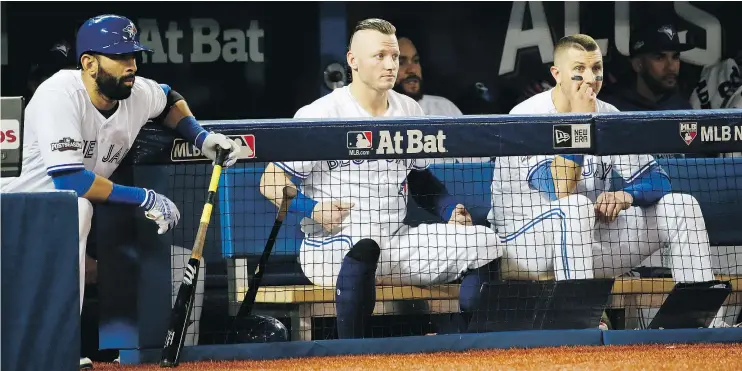  ?? — POSTMEDIA NEWS ?? From left, the Blue Jays Jose Bautista, Josh Donaldson and Troy Tulowitzki watch the final outs Monday in Cleveland’s 4-2 ALCS Game 3 win in Toronto.