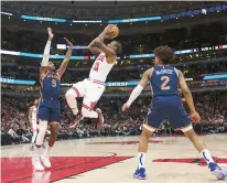  ?? ARMANDO L. SANCHEZ/CHICAGO TRIBUNE ?? Bulls forward DeMar DeRozan takes a shot over the Knicks’ RJ Barrett during the second quarter at the United Center on Dec. 14.