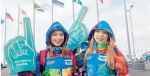  ?? WILL ENGLUND/ THEWASHING­TON POST ?? Lena Klimkina, left, and Yulia Vasilyeva, both 18- year- old Moscow college students, volunteere­d at the Sochi Olympics in Russia.