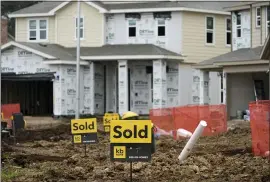 ?? DAVID J. PHILLIP — THE ASSOCIATED PRESS ?? New homes under constructi­on in Houston. The number of home-buying contracts signed in April fell 4.4% homes, the third month of declines after a yearlong rebound from the pandemic.