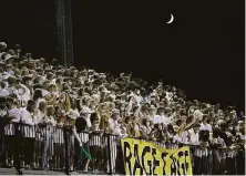  ??  ?? Fans in the St. Francis “Rage Cage” witnessed the end of De La Salle’s 318-game unbeaten streak against local opponents.