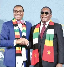  ?? ?? President Mnangagwa shares a lighter moment with African Developmen­t Bank Group president Dr Akinwumi Adesina at the Africa Investment Forum in Abidjan, Cote d’Ivoire, yesterday.