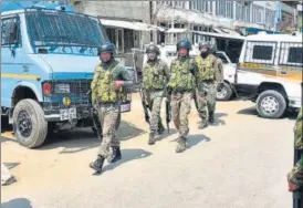  ?? H T FILE ?? Security forces stand guard in Bishamber Nagar area of Srinagar, Jammu and Kashmir.