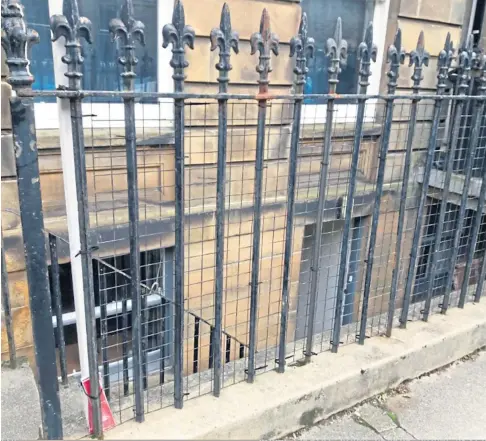  ??  ?? Wire mesh could be installed to solve the spacing problem in the railings in St Andrews.