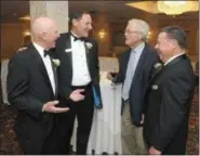  ?? GENE WALSH — DIGITAL FIRST MEDIA ?? Guest Speaker Dick Vermeil (second from right) talks with (from left) Life Time Achievemen­t recipient Bruce Williams. Coaches Hall of Fame President Dale Hood, and Coaches Hall of Fame Secretary Tony Leodora during the 17th Annual Induction Dinner of the Montgomery County Coaches Hall of Fame Tuesday.