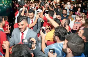  ?? — Supplied photo ?? Fans greet Syrian national team players on their arrival in Sharjah.