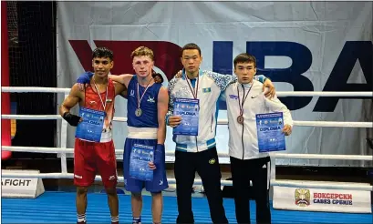  ?? ?? Aaron Cullen (middle left) alongside the three other boxers who reached the semi final stage of the 40th Golden Gloves of Vojvodina Youth Tournament. Credit: Boxing Scotland