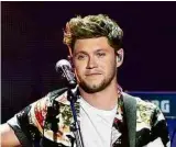  ?? Steve Marcus/Reuters ?? NIALL HORAN Conhecido por seu carisma, o cantor, compositor e guitarrist­a irlandês lançou seu primeiro trabalho solo em 2017, “Flicker”, no qual se voltou ao folk. Nele, reúne os hits “Slow Hands” e “This Town”. Atualmente, ele divulga o CD de estreia...