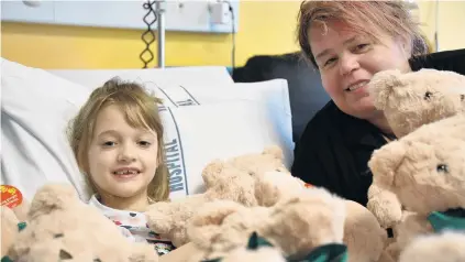  ?? PHOTO: LAURA SMITH ?? Piled up . . . Penny Smith (left) had a teddybear delivery at the Southland Hospital children’s ward from Whitcoulls Invercargi­ll supervisor Roz Waldron.