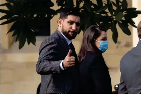  ?? (PA) ?? The former wor l d champion boxer Amir Khan arrives at Snaresbroo­k Crown Court yesterday