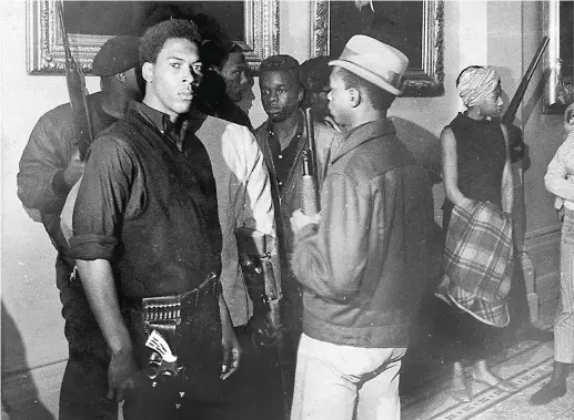  ??  ?? Armed Black Panthers at the California state-house, protesting a proposed gun control bill, May 1967. Headline-grabbing, shock tactics reinforced mainstream perception­s that Black Power meant violence