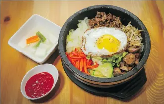  ??  ?? Han Maru’s Joung Rae Kim wanted to bring traditiona­l Korean fare like Dolsot bibimbap to the Calgary suburbs.