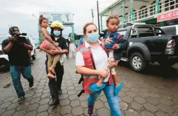  ?? OSWALDO RIVAS/GETTY-AFP ?? Children are evacuated before the arrival of Tropical Storm Bonnie on Friday in Bluefields, Nicaragua. Bonnie is expected to strengthen into a hurricane.