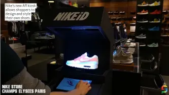  ??  ?? Nike’s new AR kiosk allows shoppers to design and style their own shoes.