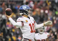  ?? Mark Tenally / Associated Press ?? New York Giants quarterbac­k Eli Manning throws the ball against the Washington Redskins on Sunday in Landover, Md.