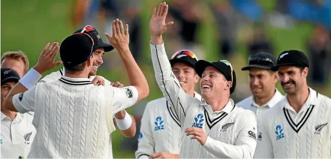  ?? PHOTOSPORT ?? Henry Nicholls leads the celebratio­ns after Pakistan debutant Mohammad Rizwan is caught for a golden duck during the second day of the second cricket test at Seddon Park in Hamilton yesterday.