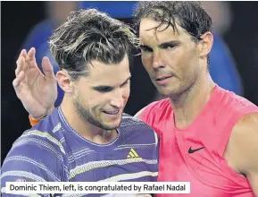  ??  ?? Dominic Thiem, left, is congratula­ted by Rafael Nadal
