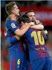  ??  ?? Lionel Messi, No 10, is congratula­ted by team-mates after a goal for Barcelona.