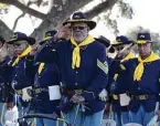  ?? Jerry Lara / Staff photograph­er ?? Members of the Bexar County Buffalo Soldiers salute at the end of a Veterans Day Ceremony at San Antonio National Cemetery.