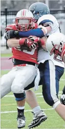  ?? METROLAND MEDIA FILE PHOTO ?? Darius Ciraco returned to the McMaster field Tuesday where he made this tackle as a member of Burlington Assumption against Hamilton’s Cardinal Newman on Nov. 21, 2013.