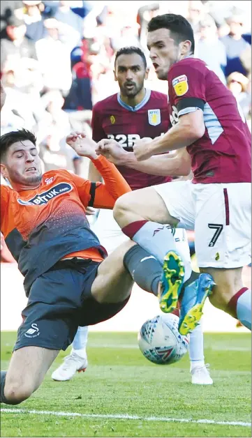  ??  ?? THWARTED: John McGinn sees his shot on goal blocked