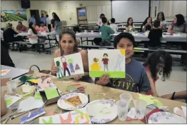  ?? Courtesy photo ?? Sixth-grade students and their families gathered at Newhall Elementary School Friday.