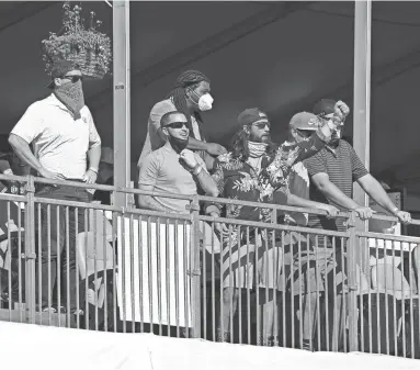  ??  ?? Fans yell from the stands at the 16th hole during round three of the Waste Management Phoenix Open at TPC Scottsdale.