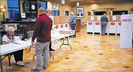  ?? [PHOTOS BY DOUG HOKE/THE OKLAHOMAN] ?? Voters cast their ballots in Edmond on Tuesday.