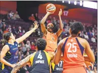  ?? Sean D. Elliot / Associated Press ?? Connecticu­t Sun center Jonquel Jones shoots over the Indiana Fever defense during a game on May 28.