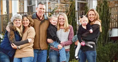  ?? CONTRIBUTE­D ?? Alexandra Faerber was close to her family. At left, she smiles with mom Febby (from left), dad Craig, nephew Cash held by sister Danielle, and niece Morgan held by sister Ashley. “She really took pride in being a nurse. And she didn’t talk about the activities, like, ‘I put in 18 IVs.’ It was all about the families and her patients,” Ashley said.