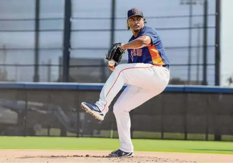  ?? Karen Warren/Staff photograph­er ?? Luis Garcia threw his first live batting practice of camp, debuting a toned-down delivery necessitat­ed by MLB rule changes.