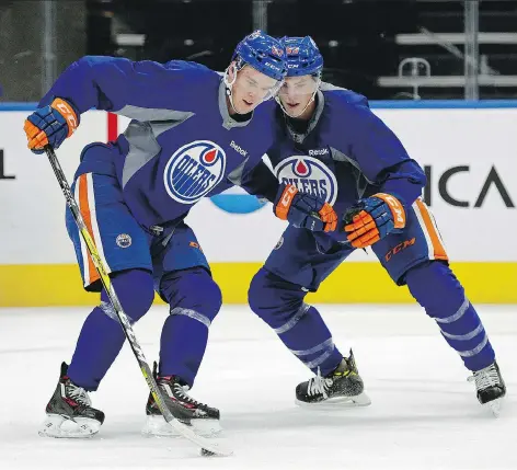  ?? LARRY WONG ?? Edmonton Oilers Connor McDavid, left, going through a drill with Ryan Nugent-Hopkins during training camp practice at Edmonton’s Rogers Place on Tuesday, appears ready to take on the captaincy of the Oilers, a role he held with Team North American at...