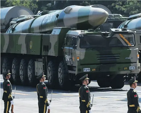 ?? GREG BAKER / AFP / GETTY IMAGES FILES ?? China was not a signatory to the Intermedia­te Range Nuclear Forces Agreement, which both the U.S. and Russia are withdrawin­g from, and it is rapidly building up its military, David J. Bercuson writes.