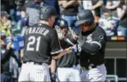  ?? KAMIL KRZACZYNSK­I — THE ASSOCIATED PRESS ?? Chicago White Sox designated hitter Avisail Garcia, right, celebrates with third baseman Todd Frazier, left, after hitting two-run home run off Minnesota Twins relief pitcher Justin Haley during the sixth inning of a baseball game, Saturday in Chicago.
