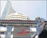  ?? REUTERS ?? A man walks past the Bombay Stock Exchange building in ■
Mumbai.