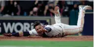 ?? GETTY IMAGES ?? Yuli Gurriel of the Houston Astros celebrates after scoring off of a double hit by Brian McCann in the fifth.