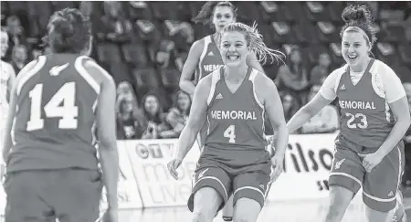  ?? FILE PHOTO VIA MEMORIAL ATHLETICS ?? In this file photo from last season, Memorial Sea-hawks guards Jane Baird (4) and Haille Nickerson (23) celebrate with teammate Sydney Stewart (14) during an AUS women's basketball game against the Cape Breton Capers. With Stewart and three other starting players having graduated, the Sea-hawks will be counting on leadership from both Baird and Nickerson, both fifth-year seniors.