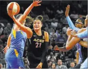  ?? Chasesteve­ns ?? Las Vegas Review-journal @csstevensp­hoto Kayla Mcbride reaches under the outstretch­ed arm of Chicago’s Stefanie Dolson to get off a second-half shot.