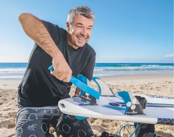  ?? Picture: JERAD WILLIAMS ?? Currumbin’s Kris O'Brien has released a new tool to remove surfboard fins. Called Finsout, the tool will be released at the end of the month.