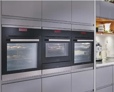  ??  ?? LEFT
Positioned at eye level, this co-ordinating range of Lamona ovens includes two touch control pyrolytic designs, an integrated combinatio­n microwave and a warming drawer.