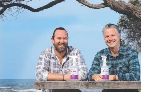  ??  ?? Mediclear co-owners Sullivan Stapleton, left, and Josh Paul with their cleaning product. Picture: Alison Wynd