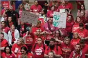  ?? AP PHOTO/DARRON CUMMINGS ?? FILE - Teachers and parents attend a rally for teachers at the Statehouse in Indianapol­is on Thursday, April 13, 2023. Despite their protest, Indiana joined the slate of states that expanded its programs that use taxpayer money to pay for private school tuition.