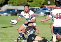  ?? PHOTOS: ROBYN EDIE/STUFF ?? Woodlands second five-eighth Tauasosi Tuimavave is tackled by his Pirates-Old Boys opposite Jaye Thompson.