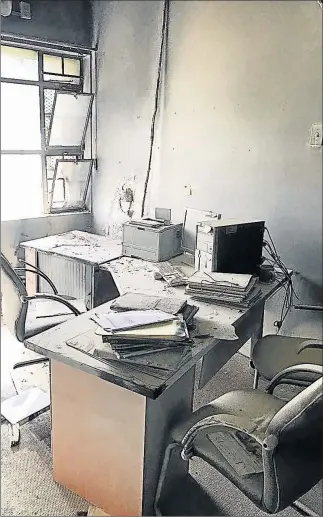  ?? Picture: ZWANGA MUKHUTHU ?? DESTROYED: The Mdantsane Sassa office was torched in a suspected arson attack yesterday