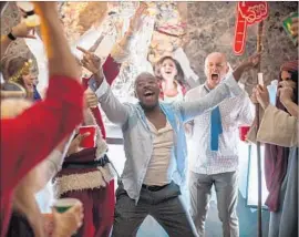  ?? Photograph­s by Glen Wilson Paramount Pictures/DreamWorks/Reliance Entertainm­ent ?? COURTNEY B. VANCE, center, makes a memorable appearance amid the fervor of frivolity spinning out of control in the holiday comedy “Office Christmas Party.”