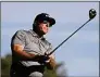  ?? Denis Poroy / Associated Press ?? Phil Mickelson hits his tee shot on the fifth hole of the South Course at Torrey Pines during the first round of the Farmers Insurance Open tournament in January.